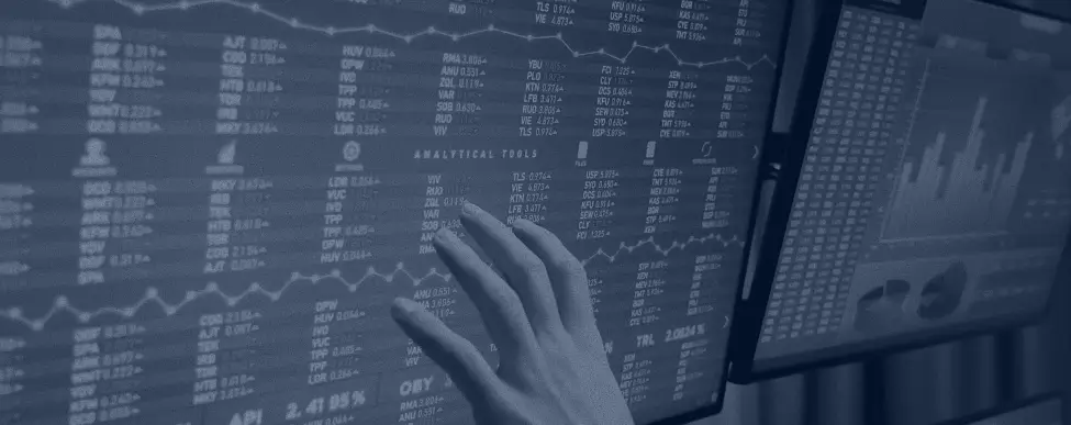 2 monitors tracking analytics with hand hovering on one monitor